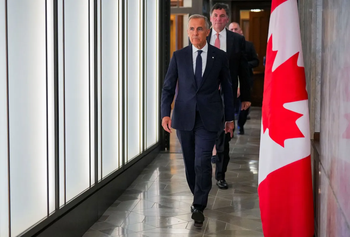 Canada’s Prime Minister Mark Carney walks to speak with the news media in Ottawa on August 22.