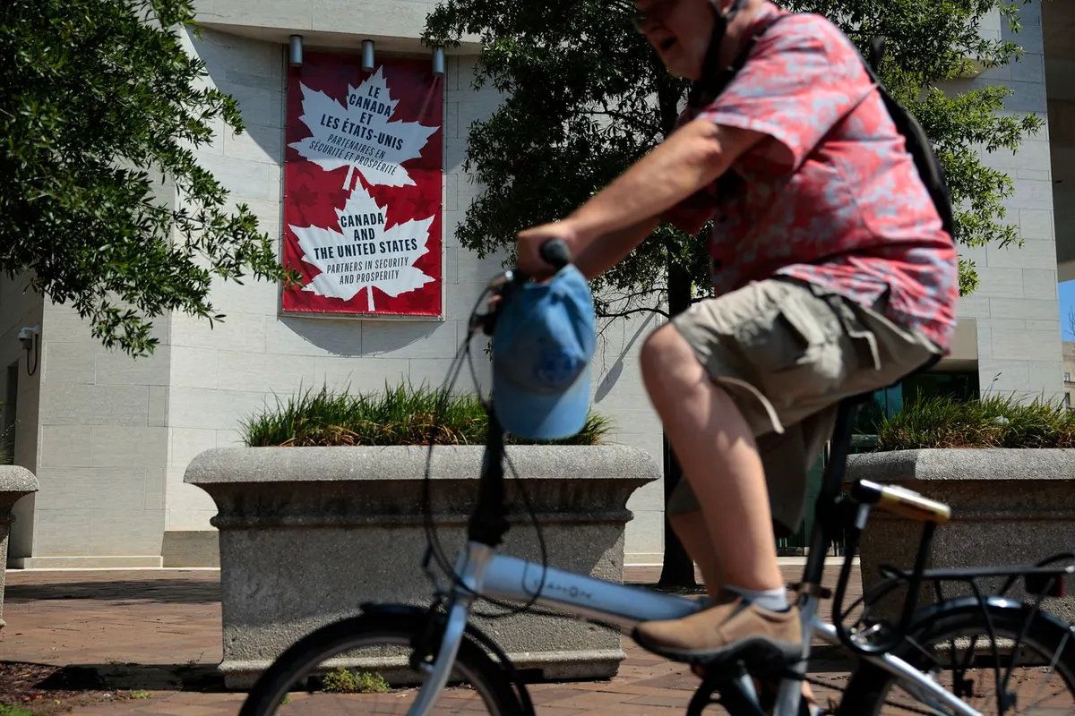 A banner celebrating Canadian-United States cooperation hangs outside the Canadian Embassy on August 26 in Washington, DC.